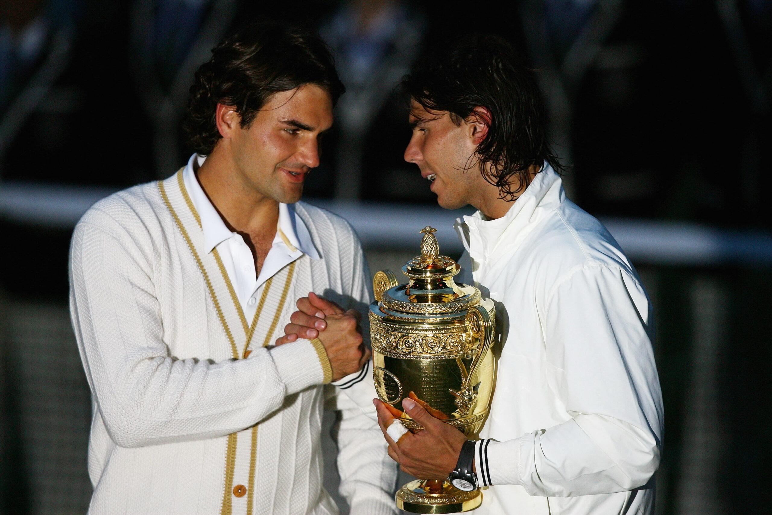 LONDON - JULY 06:  Roger Federer of Switzerland congratulates Rafael Nadal of Spain in winning the Championship trophy during the men's singles Final on day thirteen of the Wimbledon Lawn Tennis Championships at the All England Lawn Tennis and Croquet Club on July 6, 2008 in London, England.  (Photo by Julian Finney/Getty Images)