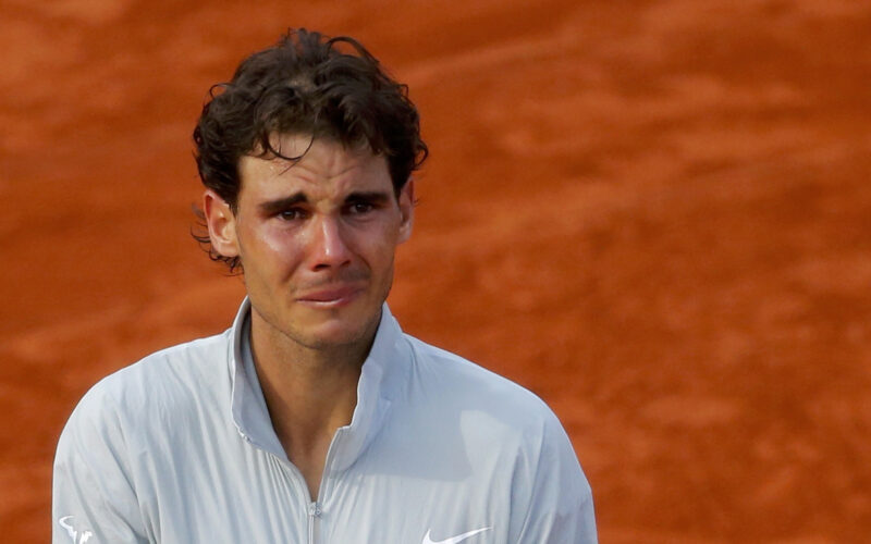 Rafael Nadal of Spain cries as he attends the trophy ceremony after defeating Novak Djokovic of Serbia during their men's singles final match to win the French Open Tennis tournament in Paris