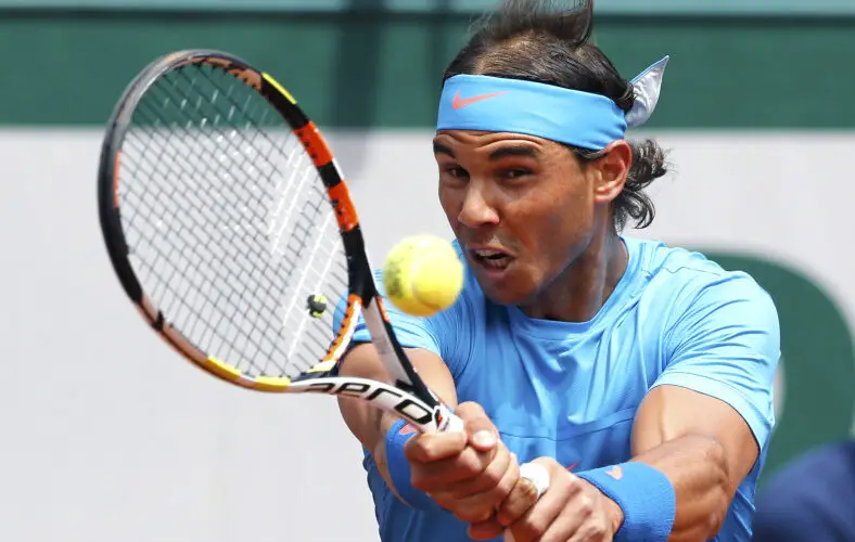 Rafael Nadal of Spain plays a shot to Quentin Halys of France during their men's singles match at the French Open tennis tournament at the Roland Garros stadium in Paris