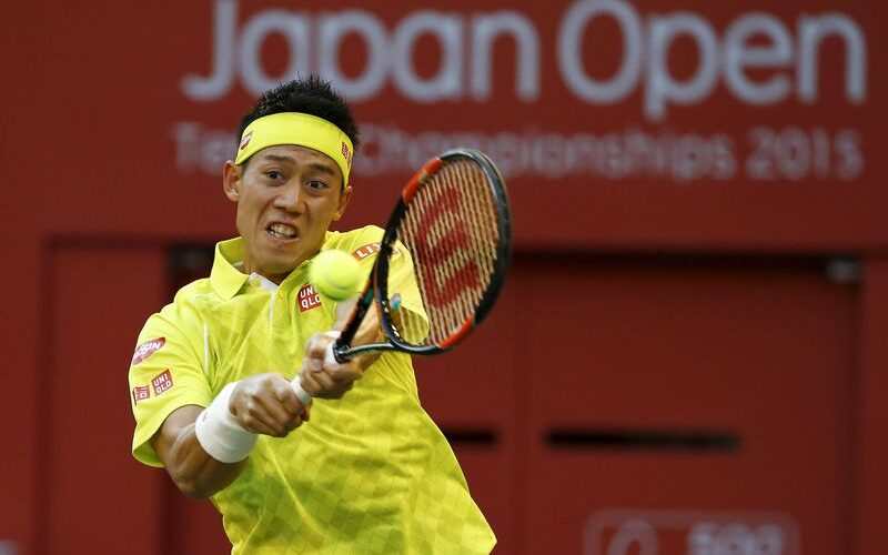 Japan's Kei Nishikori returns the ball to Sam Querrey of the U.S. during his men's singles tennis match at the Japan Open championships in Tokyo