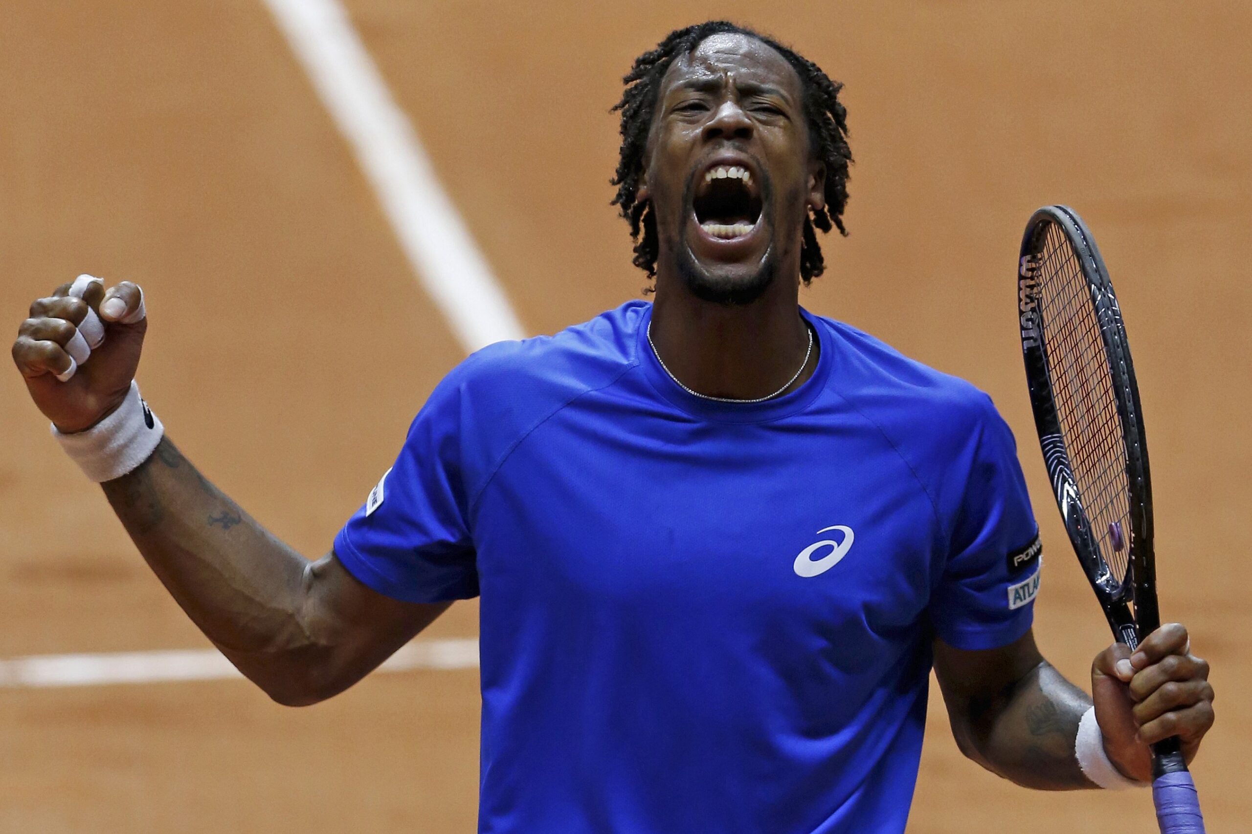 France's Monfils reacts during his Davis Cup final singles tennis match against Switzerland's Federer at the Pierre-Mauroy stadium in Villeneuve d'Ascq