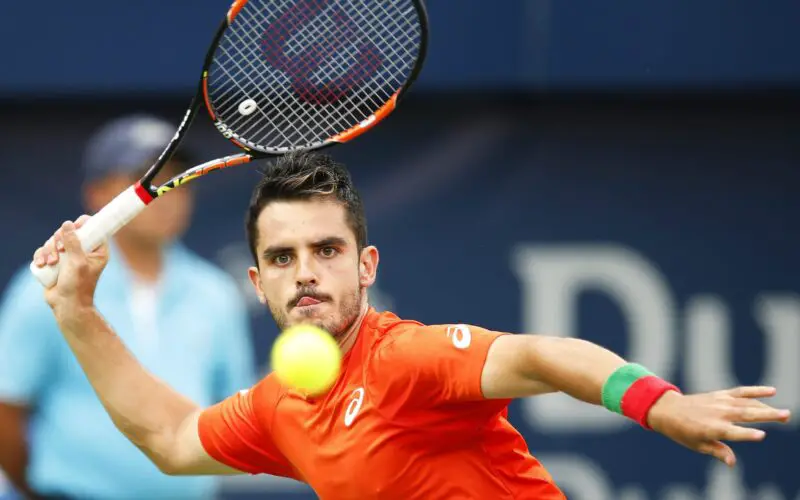 epa05178399 Thomas Fabbiano of Italy returns the ball to Tomas Berdych of the Czech Republic during their second round match of the Dubai Duty Free Tennis ATP Championships in Dubai, United Arab Emirates, 24 February 2016.  EPA/ALI HAIDER