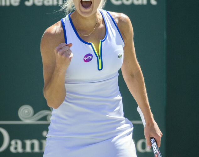 Elena Vesnina, of Russia, reacts to her shot against Sara Errani, of Italy, during their semifinal tennis match at the Volvo Car Open in Charleston, S.C., Saturday, April 9, 2016. (AP Photo/Stephen B. Morton)