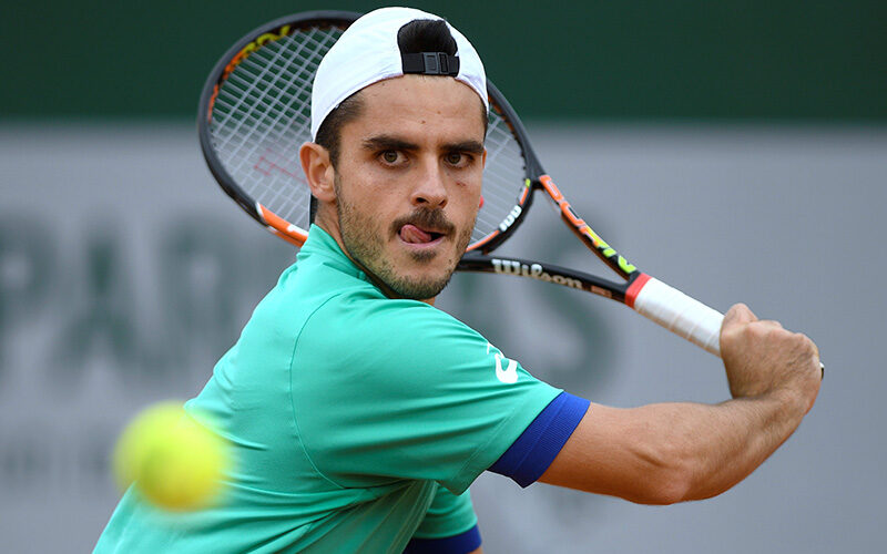 Italy's Thomas Fabbiano returns the ball to Spain's Feliciano Lopez during their men's first round match at the Roland Garros 2016 French Tennis Open in Paris on May 24, 2016. / AFP / MARTIN BUREAU        (Photo credit should read MARTIN BUREAU/AFP/Getty Images)