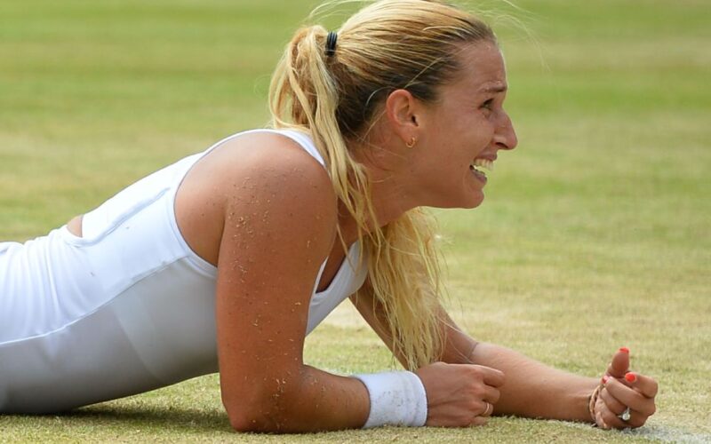 Slovakia's Dominika Cibulkova celebrates after beating Poland's Agnieszka Radwanska during their women's singles fourth round match on the eighth day of the 2016 Wimbledon Championships at The All England Lawn Tennis Club in Wimbledon, southwest London, on July 4, 2016. / AFP PHOTO / GLYN KIRK / RESTRICTED TO EDITORIAL USEGLYN KIRK/AFP/Getty Images