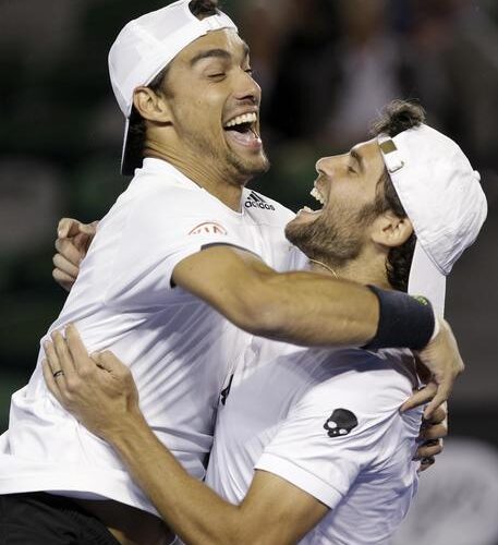 Italys Simone Bolelli, right, embraces compatriot  Fabio Fognini as they celebrate their men's doubles final win over Frances Pierre-Hugues Herbert and Nicolas Mahut at the Australian Open tennis championship in Melbourne, Australia, Saturday, Jan. 31, 2015.  (ANSA/AP Photo/Bernat Armangue)