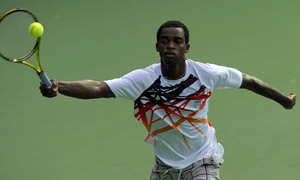 Darian King of Barbados returns against Australias Peter Luczak during their first round match of the XIX Commonwealth Games at the R. K. Khanna Stadium in New Delhi on October 4, 2010. Peter Luczak won the match by 6-3, 6-3.    AFP PHOTO/Deshakalyan CHOWDHURY (Photo credit should read DESHAKALYAN CHOWDHURY/AFP/Getty Images)
