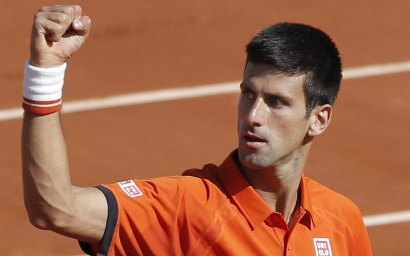 Serbia's Novak Djokovic clenches his fist after scoring a point in the quarterfinal match of the French Open tennis tournament against Spain's Rafael Nadal at the Roland Garros stadium, in Paris, France, Wednesday, June 3, 2015. (AP Photo/Christophe Ena)