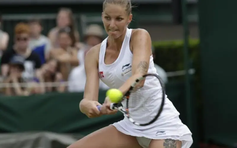 Karolina Pliskova of the Czech Republic plays a shot to Coco Vandeweghe of the United States, during their singles match at the All England Lawn Tennis Championships in Wimbledon, London, Wednesday July 1, 2015. (AP Photo/Pavel Golovkin)