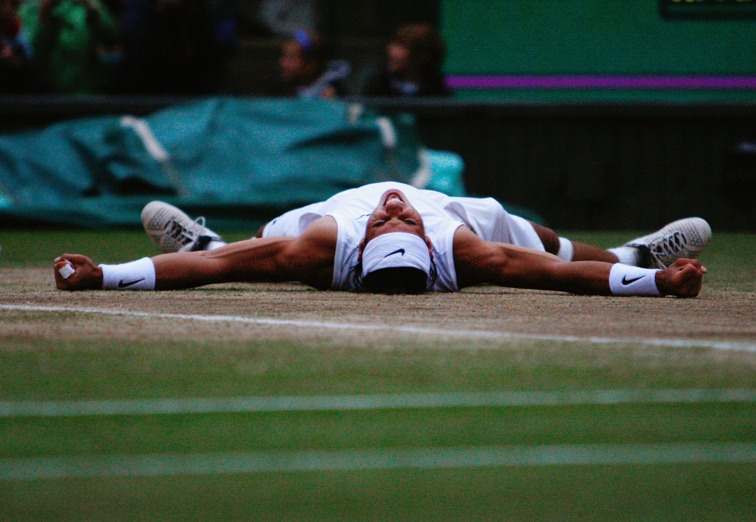 LONDON - JULY 06:  Rafael Nadal of Spain celebrates winning match point and the Championship during the men's singles Final match against Roger Federer of Switzerland on day thirteen of the Wimbledon Lawn Tennis Championships at the All England Lawn Tennis and Croquet Club on July 6, 2008 in London, England.  (Photo by Alessia Pierdomenico-Pool/Getty Images)