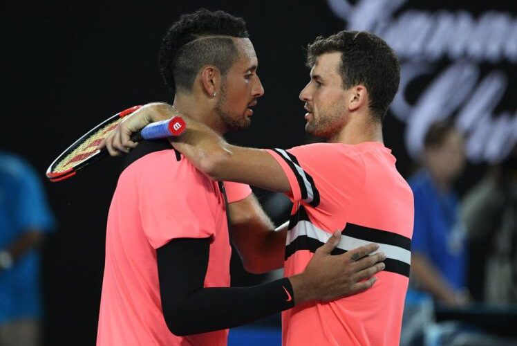 Bulgaria's Grigor Dimitrov (R) shakes hands with Australia's Nick Kyrgios after winning their men's singles fourth round match on day seven of the Australian Open tennis tournament in Melbourne on January 21, 2018. / AFP PHOTO / SAEED KHAN / -- IMAGE RESTRICTED TO EDITORIAL USE - STRICTLY NO COMMERCIAL USE --        (Photo credit should read SAEED KHAN/AFP/Getty Images)