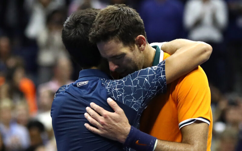 NEW YORK, NY - SEPTEMBER 09: Novak Djokovic of Serbia hugs Juan Martin del Potro of Argentina after their men's Singles finals match on Day Fourteen of the 2018 US Open at the USTA Billie Jean King National Tennis Center on September 9, 2018 in the Flushing neighborhood of the Queens borough of New York City.   Al Bello/Getty Images/AFP