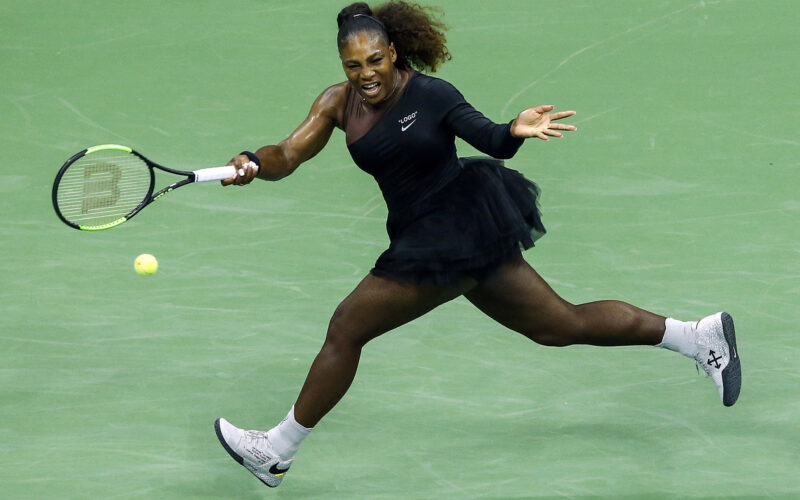 TOPSHOT - Serena Williams of the US hits a return to Magda Linette (out of frame) of Poland during their 2018 US Open Women's Singles match at the USTA Billie Jean King National Tennis Center in New York on August 27, 2018. (Photo by EDUARDO MUNOZ ALVAREZ / AFP)        (Photo credit should read EDUARDO MUNOZ ALVAREZ/AFP/Getty Images)