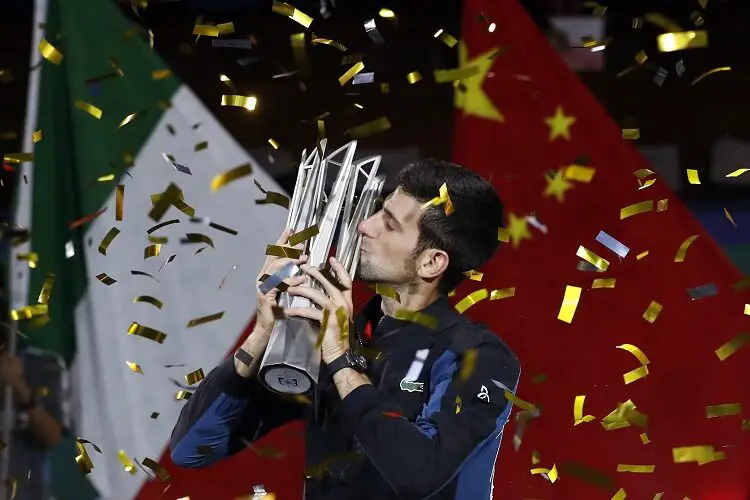 Tennis - Shanghai Masters - Men's Singles - Qi Zhong Tennis Center, Shanghai, China - October 14, 2018. Novak Djokovic of Serbia celebrates with the trophy after winning the final against Borna Coric of Croatia. REUTERS/Aly Song