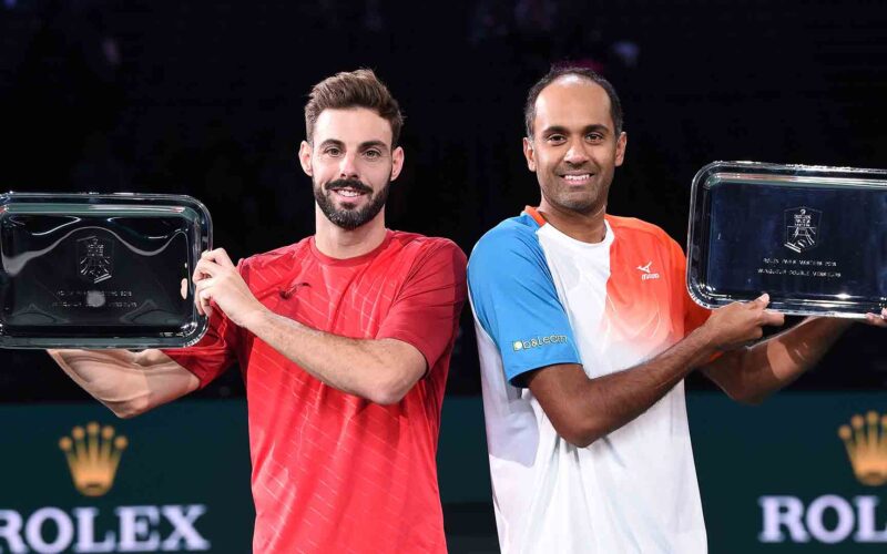 Rajeev Ram of the US (R) and Spain's Marcel Granollers pose with their trophies after winning the men's doubles final tennis match, against Netherlands' Jean-Julien Rojer and Romania's Horia Tecau, on day seven of the ATP World Tour Masters 1000 - Rolex Paris Masters - indoor tennis tournament at The AccorHotels Arena in Paris, on November 4, 2018. (Photo by Anne-Christine POUJOULAT / AFP)        (Photo credit should read ANNE-CHRISTINE POUJOULAT/AFP/Getty Images)