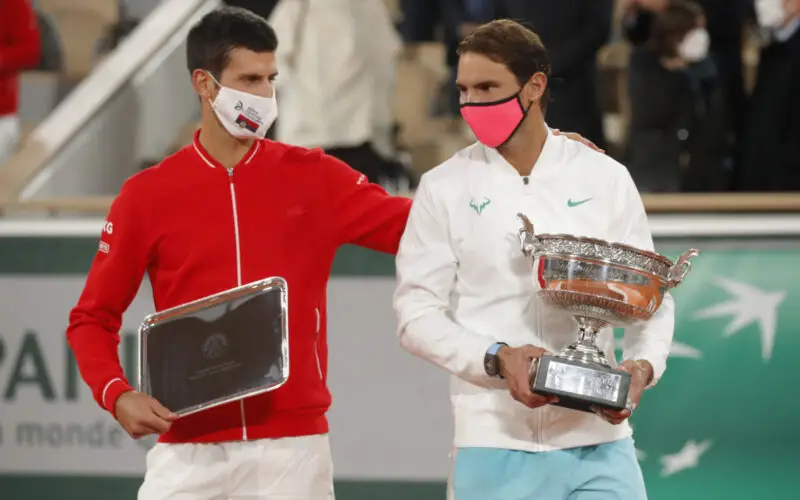Tennis - French Open - Roland Garros, Paris, France - October 11, 2020 Runner up Novak Djokovic of Serbia alongside French Open winner Rafael Nadal of Spain as they are presented with their trophies after the final REUTERS/Charles Platiau