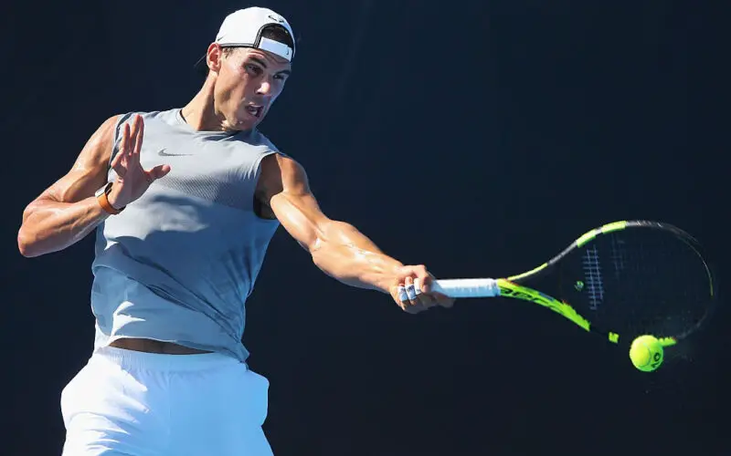 MELBOURNE, AUSTRALIA - JANUARY 10:  The powerful left arm of Raphael Nadal of Spain hits a forehand during a practice session ahead of the 2017 Australian Open at Melbourne Park on January 10, 2017 in Melbourne, Australia.  (Photo by Michael Dodge/Getty Images)
