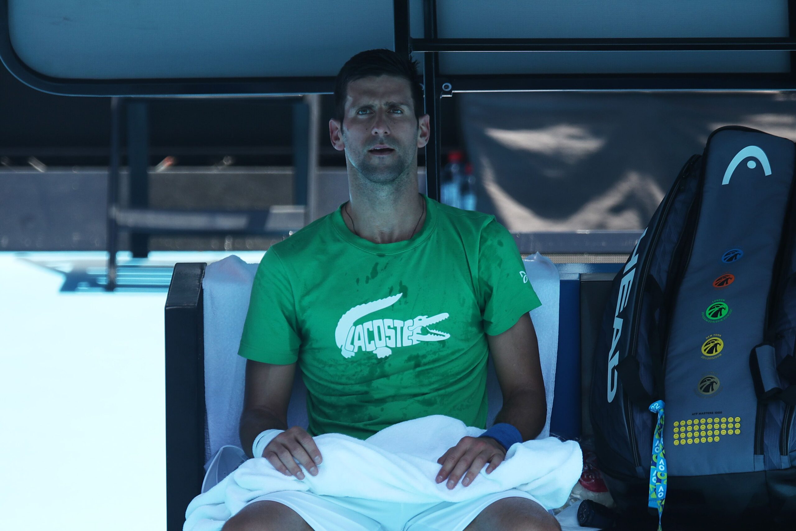 MELBOURNE, AUSTRALIA - JANUARY 13: Novak Djokovic of Serbia looks on during a practice session ahead of the 2022 Australian Open at Melbourne Park on January 13, 2022 in Melbourne, Australia. (Photo by Graham Denholm/Getty Images)