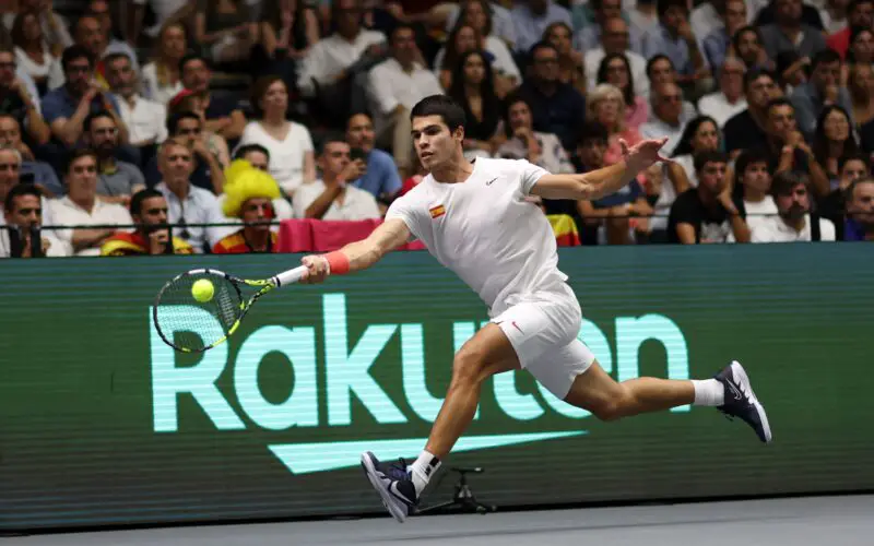 VALENCIA, SPAIN - SEPTEMBER 16: Carlos Alcaraz of Team Spain plays a forehand against Felix Auger Aliassime of Team Canada during the Davis Cup Group Stage 2022 Valencia match between Spain and Canada at Pabellon Fuente De San Luis on September 16, 2022 in Valencia, Spain. (Photo by Clive Brunskill/Getty Images)