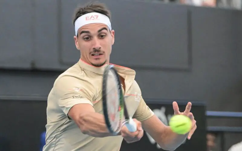Lorenzo Sonego of Italy hits a return against Daniil Medvedev of Russia in the men's first round tennis match at the ATP Adelaide International tournament in Adelaide on January 3, 2023. - - -- IMAGE RESTRICTED TO EDITORIAL USE - STRICTLY NO COMMERCIAL USE -- (Photo by Brenton EDWARDS / AFP) / -- IMAGE RESTRICTED TO EDITORIAL USE - STRICTLY NO COMMERCIAL USE -- (Photo by BRENTON EDWARDS/AFP via Getty Images)