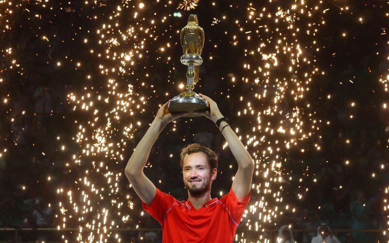 Russia's Daniil Medvedev celebrates on the podium with his trophy after defeating Britain's Andy Murray during their Qatar Open final tennis match in Doha, on February 25, 2023. (Photo by KARIM JAAFAR / AFP) (Photo by KARIM JAAFAR/AFP via Getty Images)