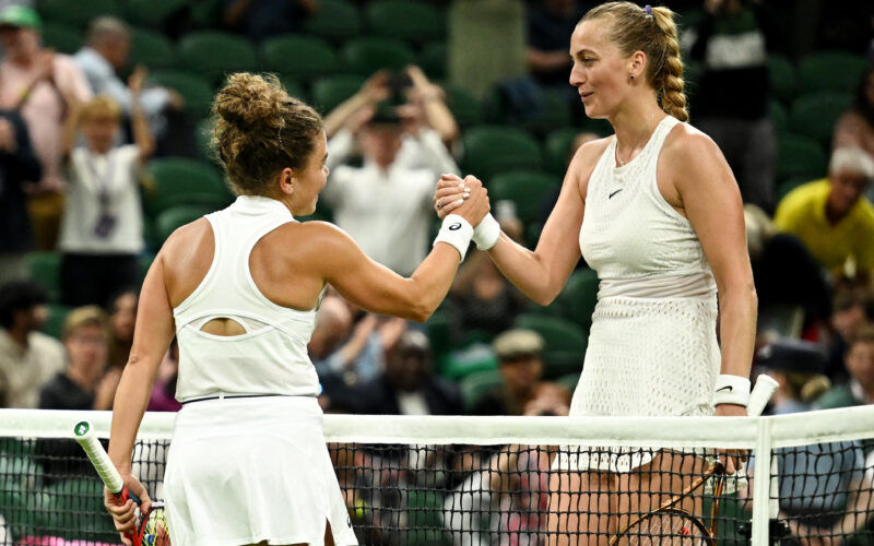Tennis - Wimbledon - All England Lawn Tennis and Croquet Club, London, Britain - July 5, 2023 Czech Republic's Petra Kvitova shakes hands with  Italy's Jasmine Paolini after winning her first round match REUTERS/Dylan Martinez