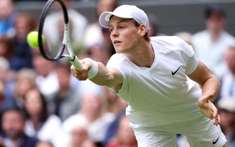 epa11450750 Jannik Sinner of Italy in action during the Men's 1st round match against Yannick Hanfmann of Germany at the Wimbledon Championships, Wimbledon, Britain, 01 July 2024.  EPA/ADAM VAUGHAN  EDITORIAL USE ONLY