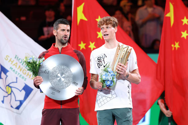 SHANGHAI, CHINA - OCTOBER 13: Jannik Sinner (R) of Italy and Novak Djokovic of Serbia pose with the trophy during the award ceremony after Men's Singles final match on Day 14 of 2024  Shanghai Rolex Masters at Qi Zhong Tennis Centre on October 13, 2024 in Shanghai, China. (Photo by Lintao Zhang/Getty Images)
