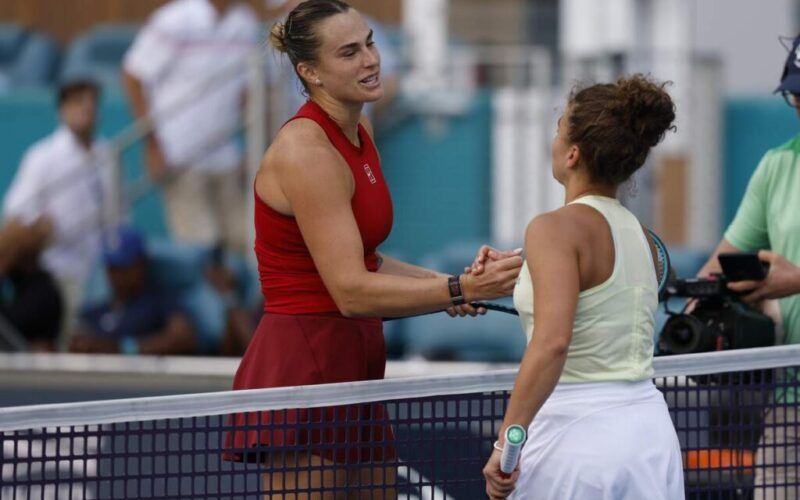 Mar 27, 2025; Miami, FL, USA; Aryna Sabalenka (L) shakes hands with Jasmine Paolini (ITA)(R) at the net after their women's singles semifinal on day ten of the Miami Open at Hard Rock Stadium. Mandatory Credit: Geoff Burke-Imagn Images/Sipa USA
