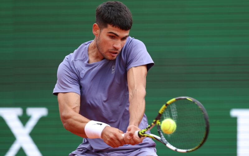 MONTE-CARLO, MONACO - APRIL 09: Carlos Alcaraz of Spain plays a backhand against Francisco Cerundolo of Argentina during the Men's Singles Second Round match on day four of the Rolex Monte-Carlo Masters at Monte-Carlo Country Club on April 09, 2025 in Monte-Carlo, Monaco. (Photo by Clive Brunskill/Getty Images)